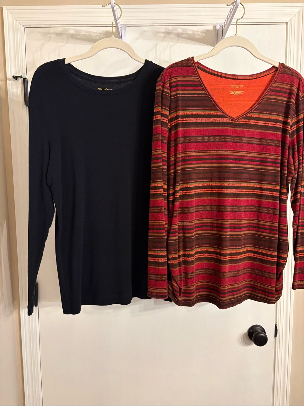 A pair of long sleeve tops